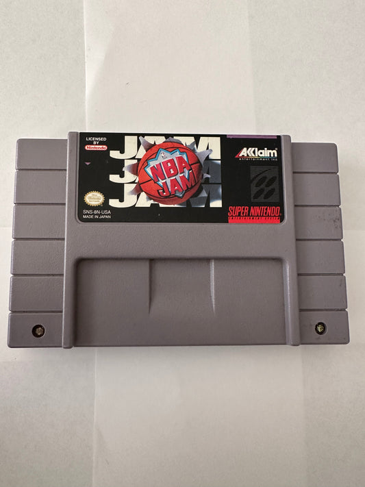 NBA jam for the Super Nintendo. Small crack on back of game.